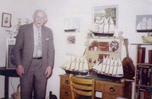 Frank Treat with his collection of model ships he built