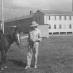 Commander Wilkinson with horse by Admin building on Ocracoke US Navt OPS Collection